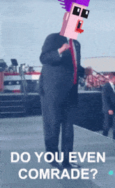 a man in a suit and tie is standing on a stage with the words do you even comrade written below him