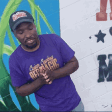 a man in a purple cajun cowboy republic shirt