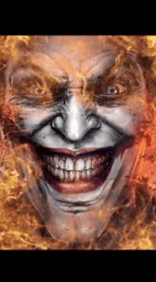a close up of a joker 's face with a huge smile on it .