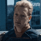 a close up of a man 's face with the word boys on the bottom