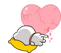 a cartoon cat laying on a yellow pillow with a broken heart behind it