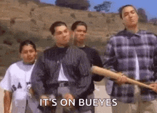 a group of young men are standing next to each other holding baseball bats and saying `` it 's on bueyes '' .