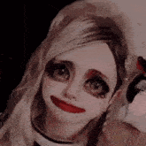 a close up of a person 's face with makeup