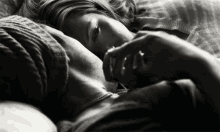 a black and white photo of a man and woman sleeping
