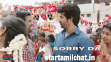 a man in a blue shirt stands in front of a crowd with the words sorry da starttamilchat.in