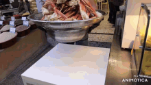 a large bowl of food is on a table with the words made in animotica on the bottom right