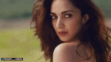 a close up of a woman 's face with the words pranay varma on the bottom right