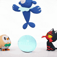 a blue cartoon character is doing a handstand while a cat looks on