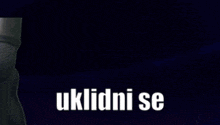 a blurred image of a person with the words " uklidni se " in white letters