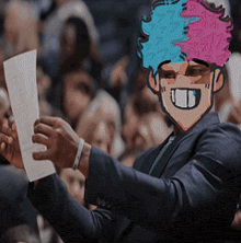 a man in a suit is holding a piece of paper with a cartoon face on it