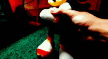 a close up of a person holding a stuffed animal