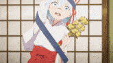 a girl in a kimono is holding a large object