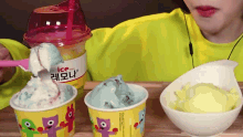 a woman is eating ice cream in a cup with a spoon