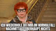 a woman with red hair and glasses is standing on a set of stairs with a caption .