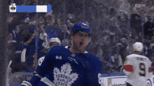 a hockey player with the word toronto maple on his helmet