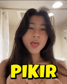 a woman with her tongue out and the word pikir on the bottom right