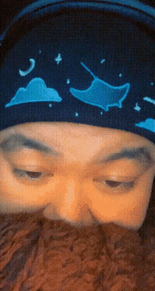 a close up of a person 's face with a hat on