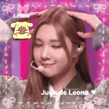 a picture of a girl with a pompompurin sticker on her head .