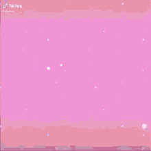 a pink nintendo switch with a video game on it .