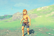 a video game character without a shirt is standing in a grassy field