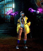 a woman in a yellow jacket is standing in front of a brick building