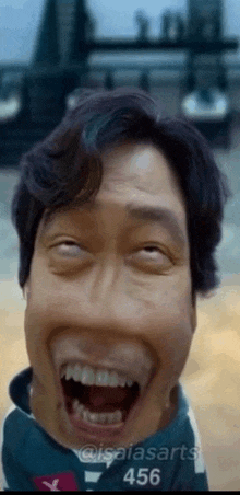 a close up of a man 's face with his mouth open and the number 456 on the bottom