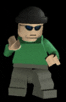 a lego man wearing sunglasses and a green shirt is standing in front of a black background .