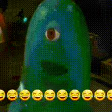 a green monster with a big eye is surrounded by laughing emojis .