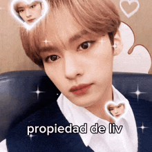 a close up of a person 's face with the words " propiedad de liv " written below it