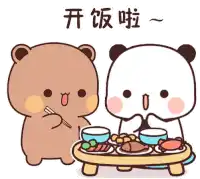 a couple of bears are sitting at a table eating food .