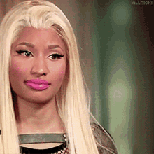 a close up of a woman 's face with the word allnicki on the bottom