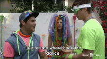 a man in a neon green shirt says " just tell me where i need to dance .. "