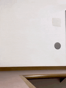 a white wall with a circle on it that says ' a ' on it