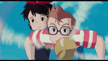 a boy with glasses is holding a girl on his shoulders