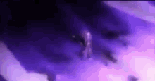 a person is flying through a cloud of purple smoke in the sky .