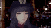 a woman wearing a hat with the letter v on it smiles