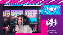 a woman wearing headphones is talking into a microphone in front of a cooler master logo