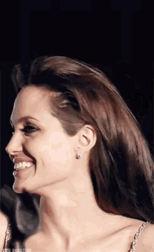 a close up of a woman 's face with the words jodie dentillo written on the bottom