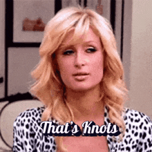a woman is wearing a leopard print shirt and says that 's knots .