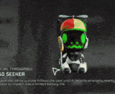 a man in a helmet and cape with the number 7 on his back is standing in a desert .