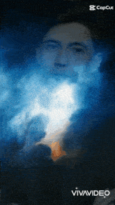 a man in a suit is surrounded by blue smoke and the words vivavideo on the bottom right