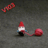 a picture of a gnome holding a ball of yarn with the words love it below it