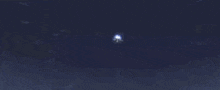 a futuristic space ship is flying through the air in a blue background .