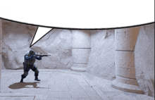 a man holding a gun in a room with a speech bubble