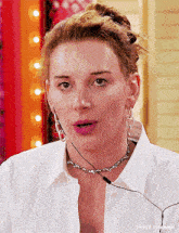 a close up of a woman wearing a white shirt and earrings with t4yce tumblr in the corner