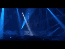 the word alive is on a stage in front of a crowd