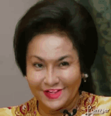 a close up of a woman 's face with a red lip and a yellow dress .