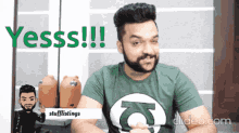 a man with a beard wearing a green shirt says yesss !!!