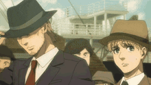 a man in a suit and tie stands next to a boy in a hat