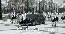 a group of men riding horses in front of a limousine that says all hail the king on the bottom